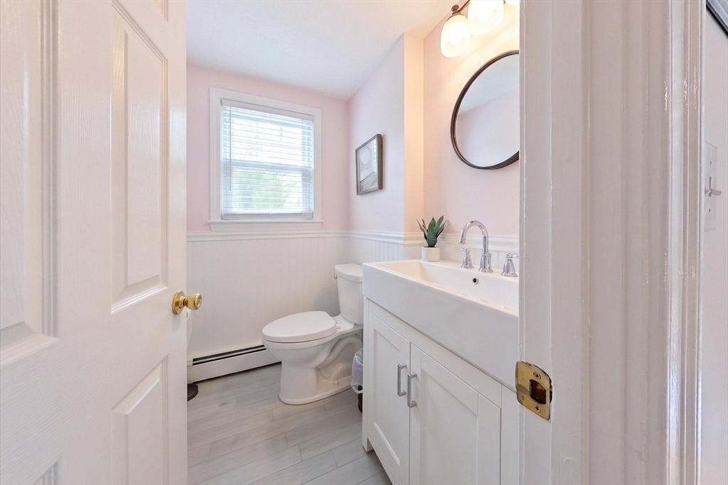59 First Parish Road Norwell, MA 02061 - Photo 15 of 37 a bathroom with a sink a toilet and a mirror