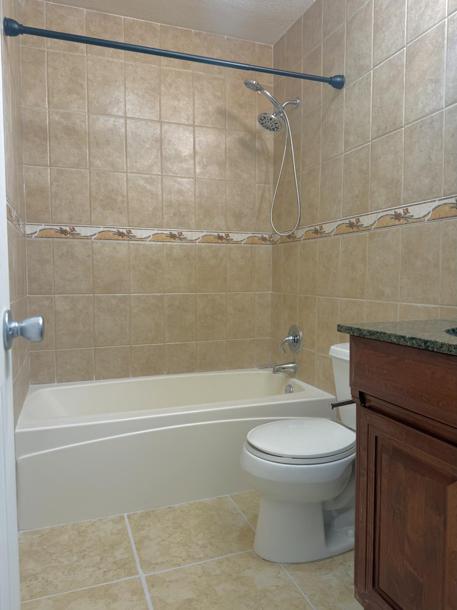 199 East McNab Road, Unit 109 Pompano Beach, FL 33060 - Photo 11 of 17 a bathroom with a toilet and a shower