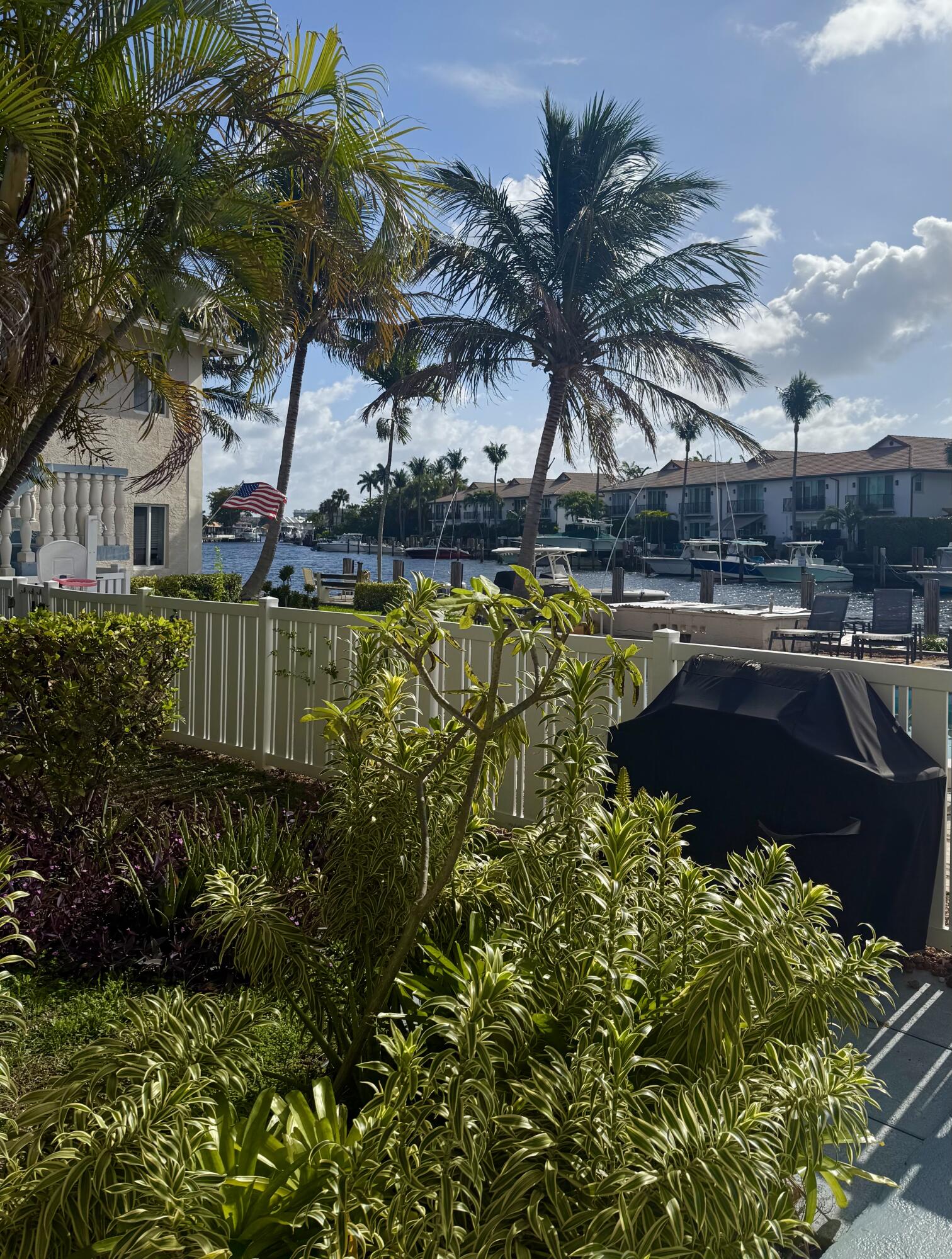 199 East McNab Road, Unit 109 Pompano Beach, FL 33060 - Photo 15 of 17 a view of a swimming pool with a garden