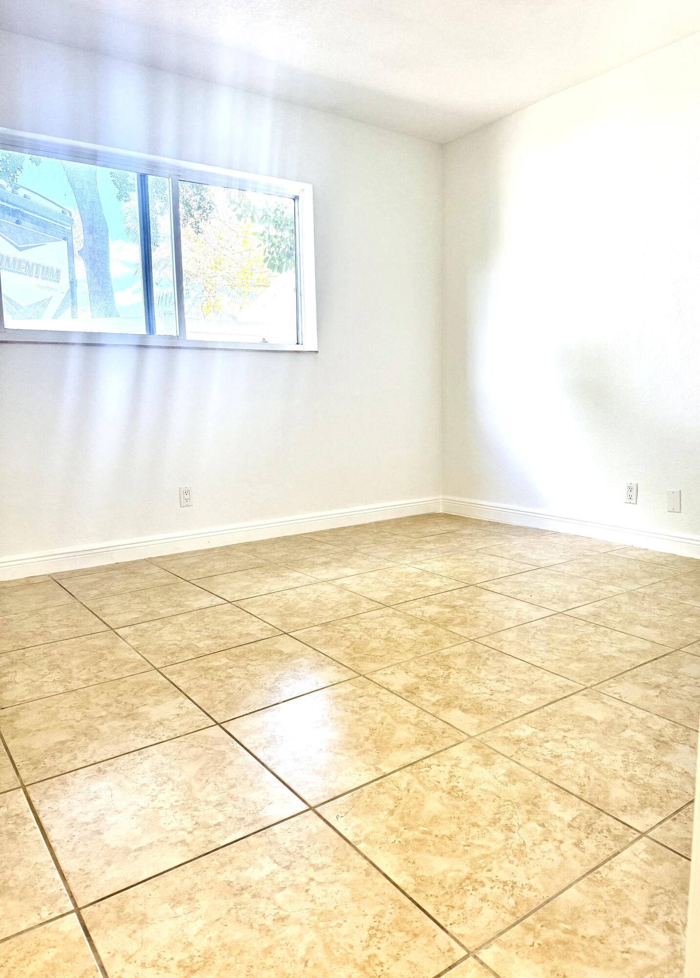 199 East McNab Road, Unit 109 Pompano Beach, FL 33060 - Photo 9 of 17 a view of an empty room and window