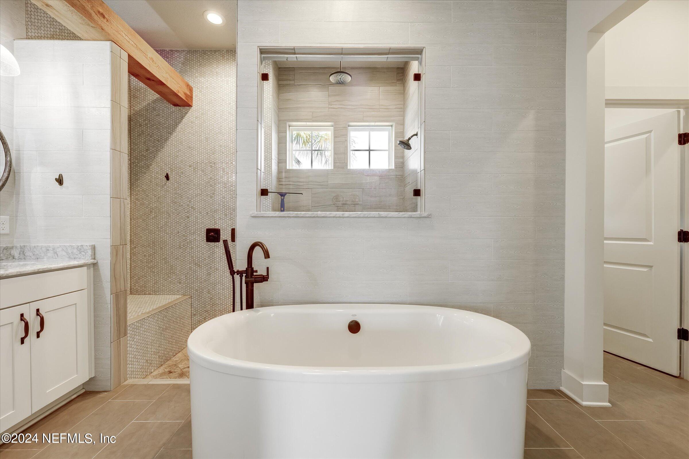 75 Bronson Parkway St. Augustine, FL 32095 - Photo 24 of 55 a white bath tub sitting next to a white sink