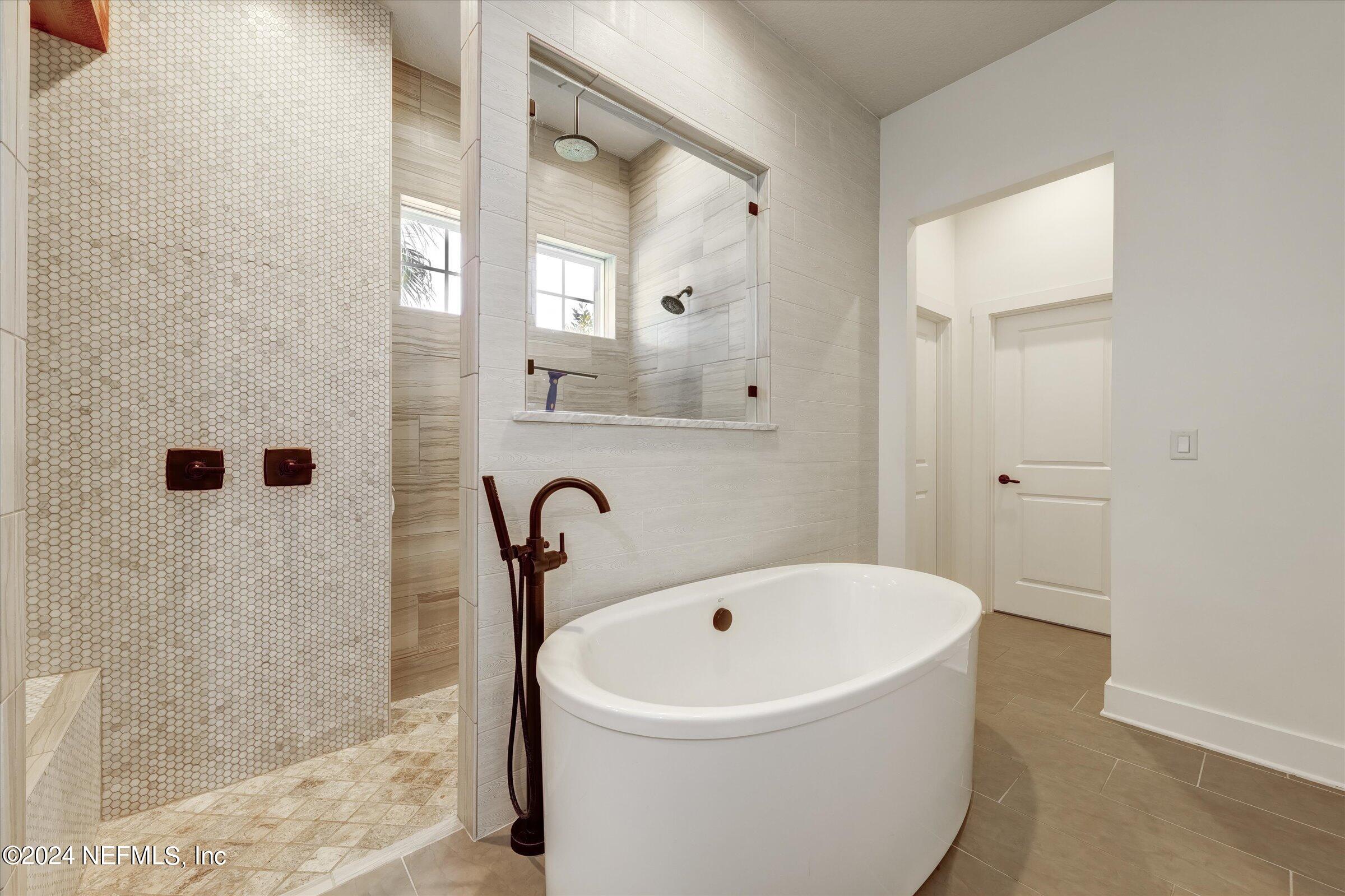 75 Bronson Parkway St. Augustine, FL 32095 - Photo 25 of 55 a white bath tub sitting next to a white sink