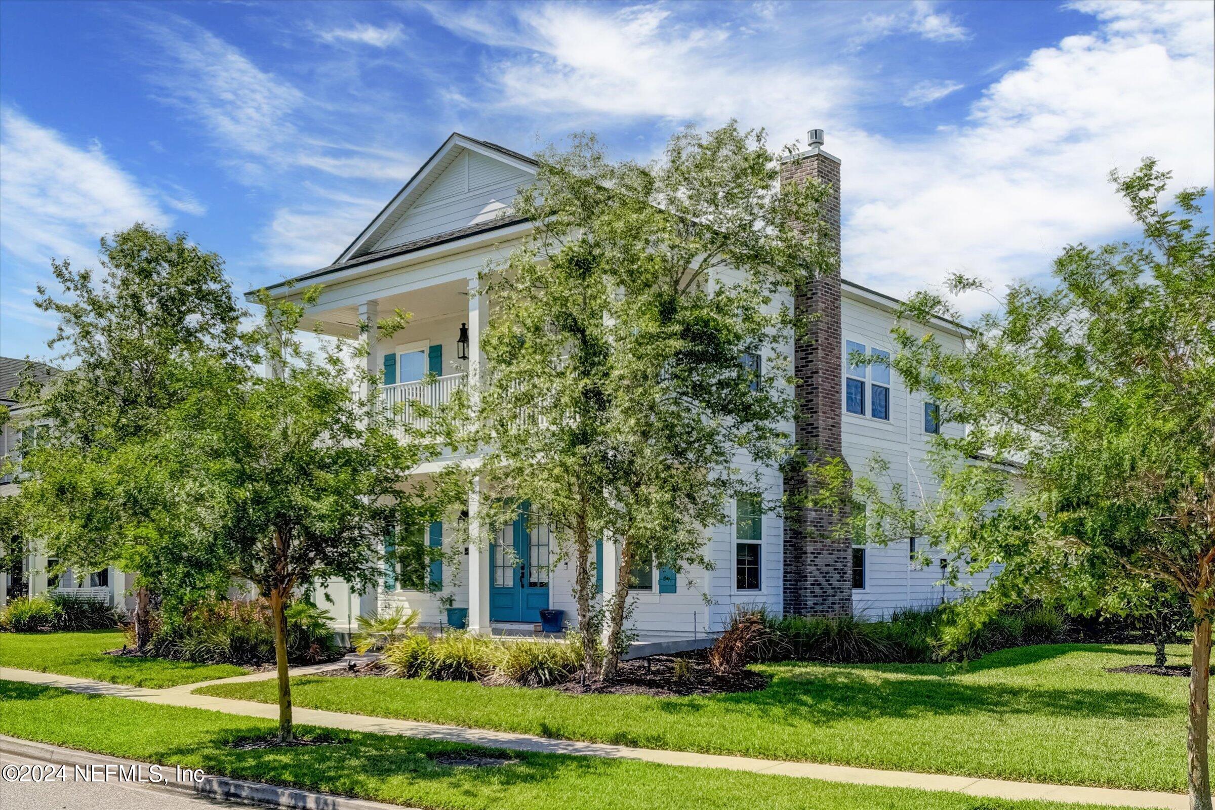 75 Bronson Parkway St. Augustine, FL 32095 - Photo 3 of 55 a front view of a house with garden