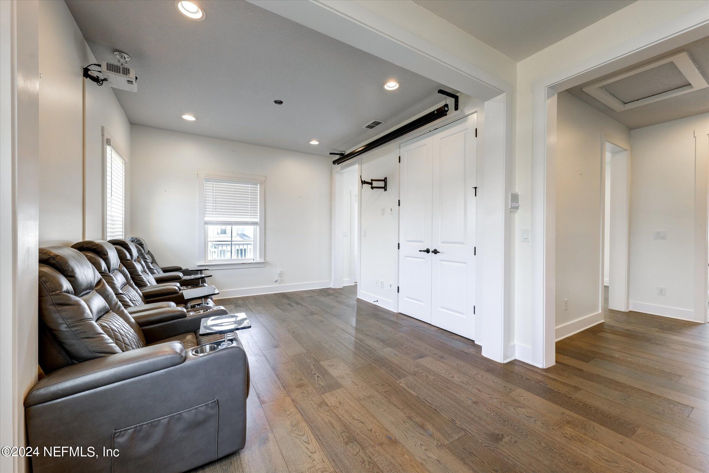 75 Bronson Parkway St. Augustine, FL 32095 - Photo 31 of 55 a living room with furniture and wooden floor