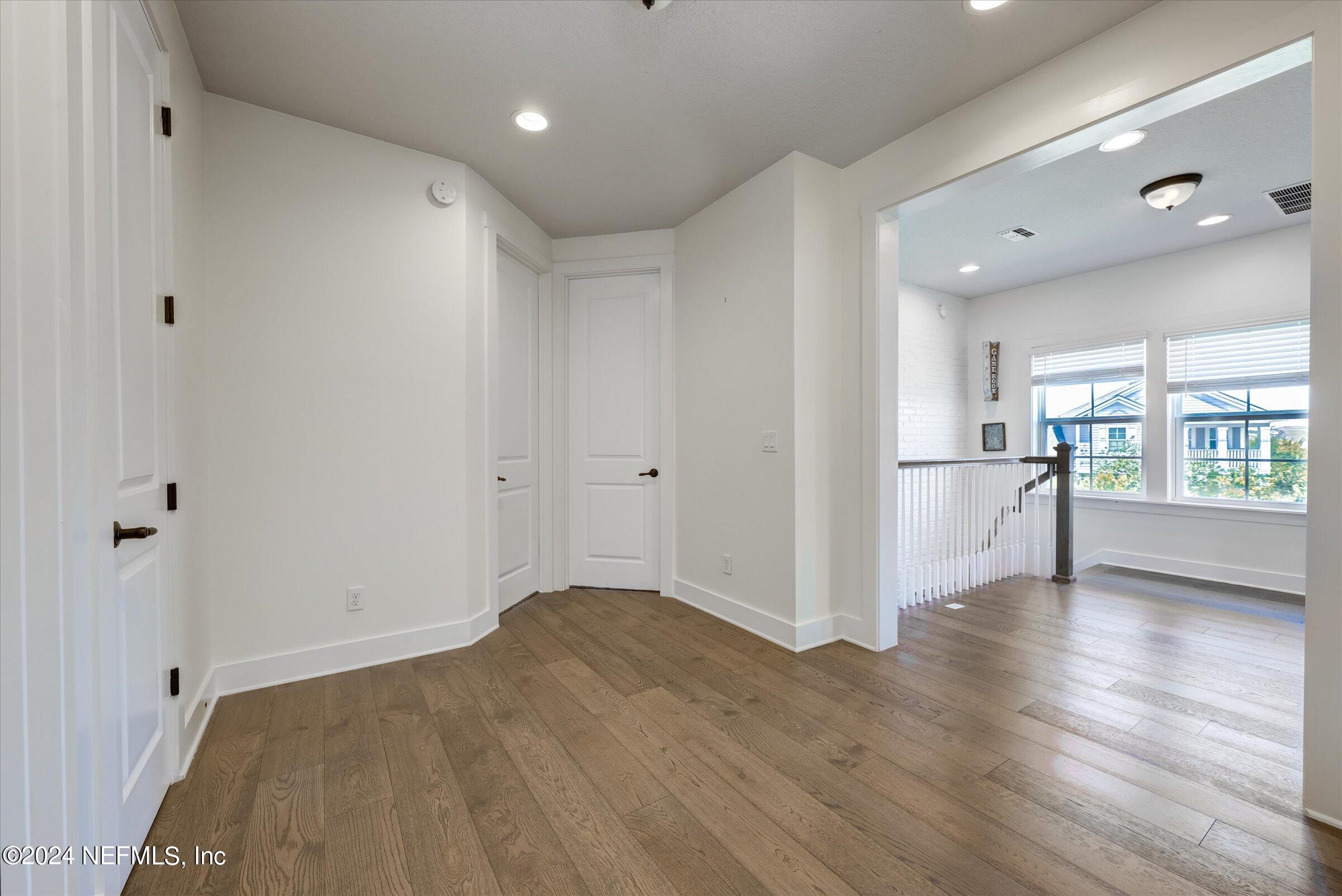 75 Bronson Parkway St. Augustine, FL 32095 - Photo 41 of 55 a view of a kitchen with wooden floor and a window