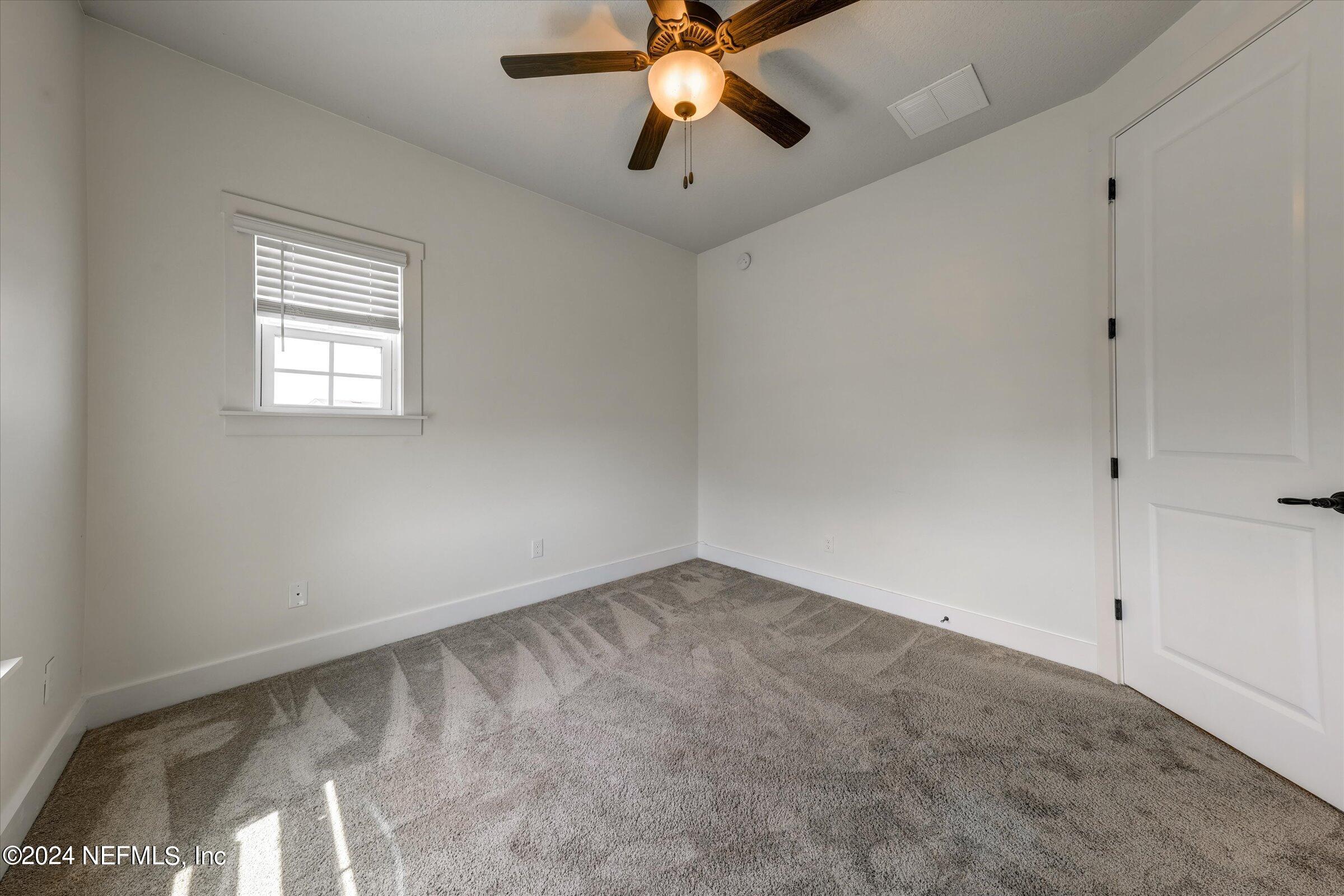 75 Bronson Parkway St. Augustine, FL 32095 - Photo 43 of 55 a view of an empty room and chandelier fan