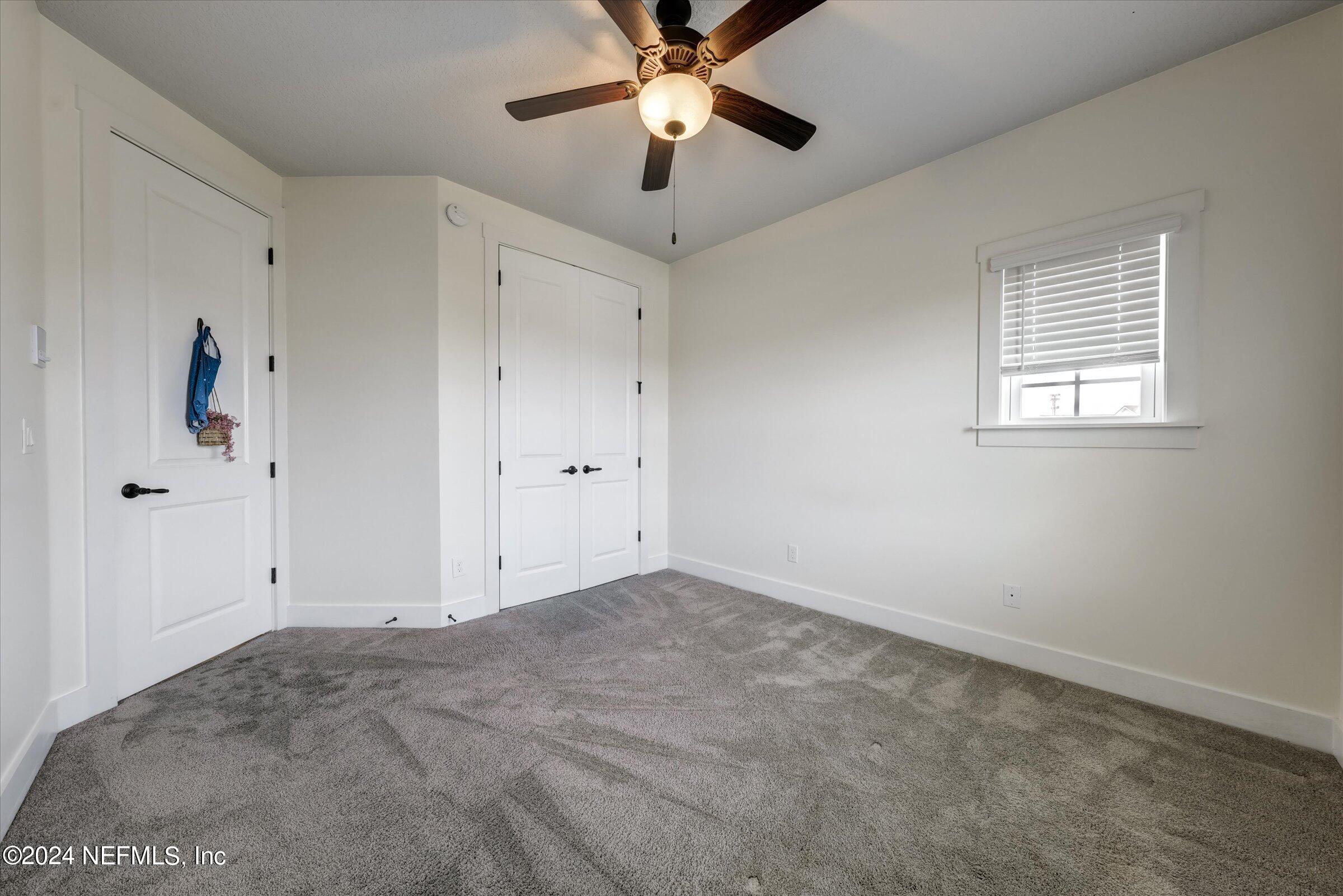 75 Bronson Parkway St. Augustine, FL 32095 - Photo 47 of 55 a view of a livingroom with a ceiling fan and window