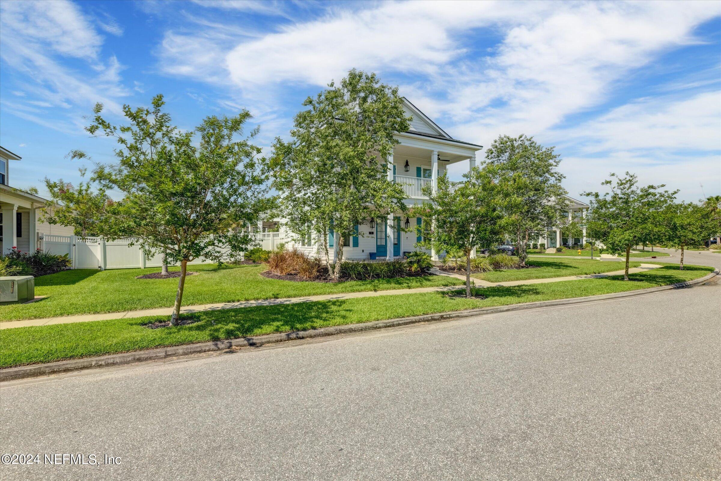 75 Bronson Parkway St. Augustine, FL 32095 - Photo 7 of 55 a view of a house with a big yard and large trees