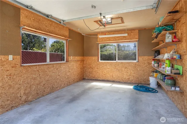 a front view of a house with basket ball court and outdoor seating
