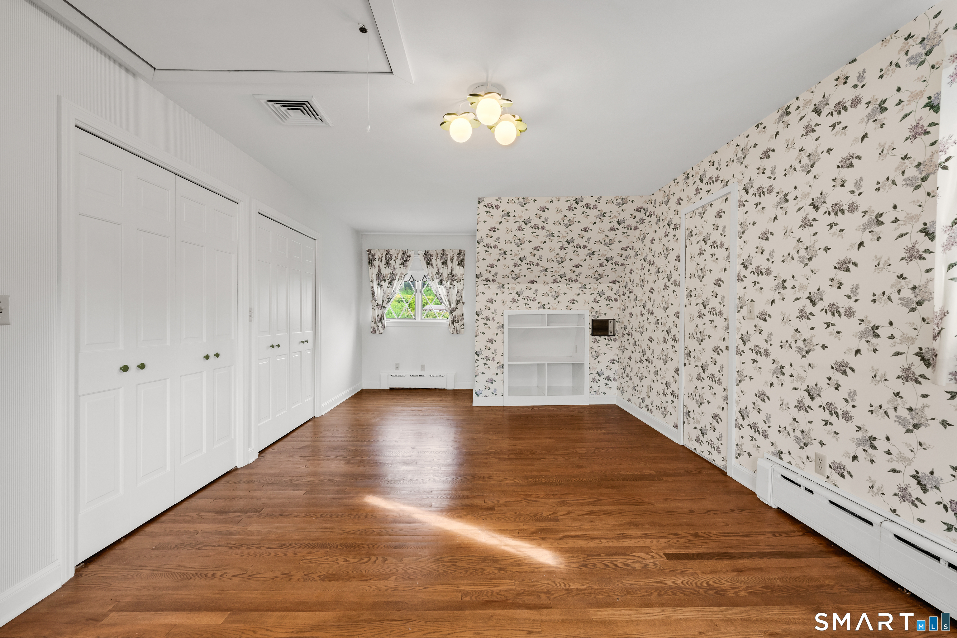 232 Maybrook Road Waterbury, CT 06708 - Photo 29 of 38 a view of empty room with wooden floor