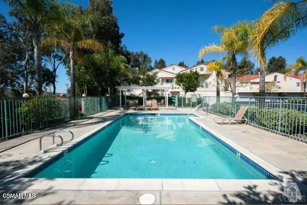 a view of swimming pool with a patio