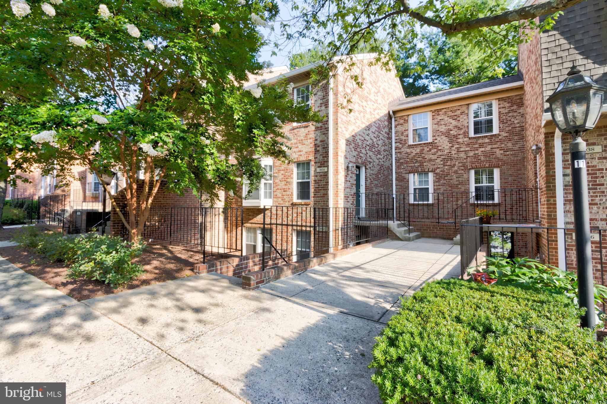 3934 Chesterwood Drive, Unit 3934 Silver Spring, MD 20906 - Photo 1 of 26 a view of a patio with table and chairs and potted plants