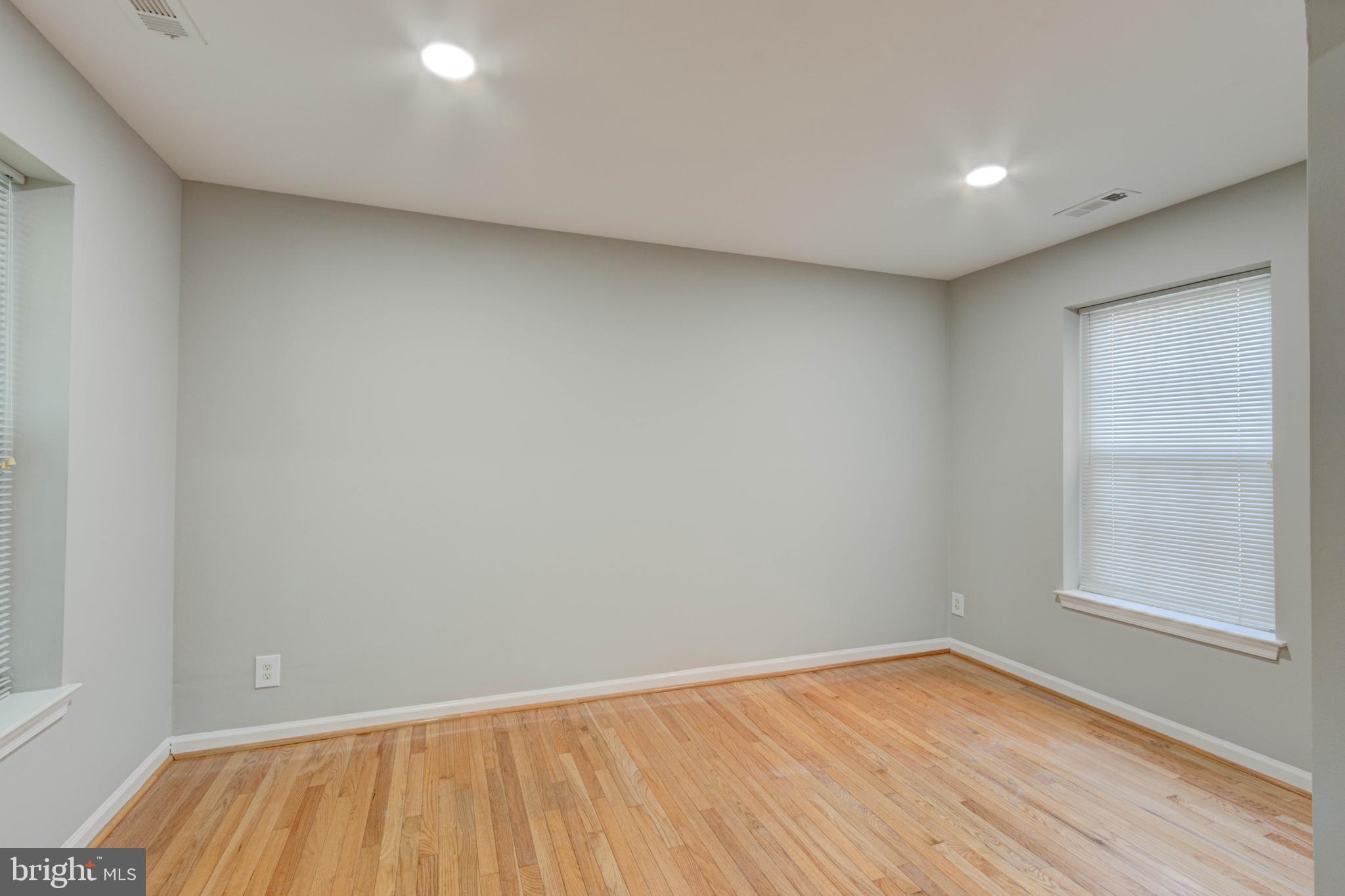 3934 Chesterwood Drive, Unit 3934 Silver Spring, MD 20906 - Photo 11 of 26 a view of room with window and wooden floor