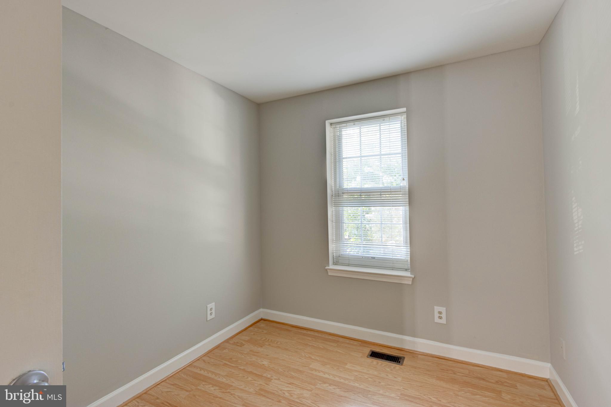 3934 Chesterwood Drive, Unit 3934 Silver Spring, MD 20906 - Photo 15 of 26 a view of a room with wooden floor and window