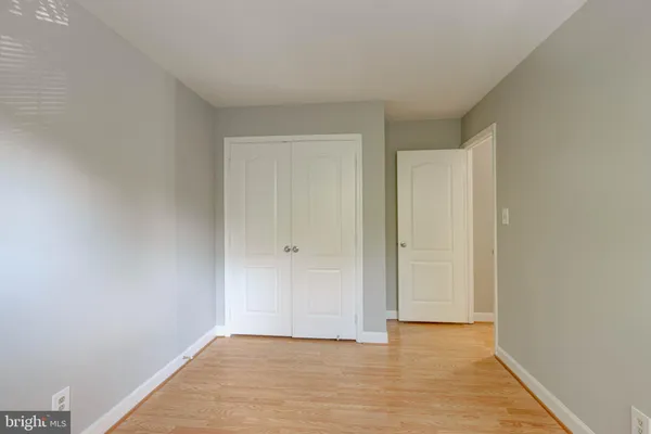 a view of an empty room and wooden floor