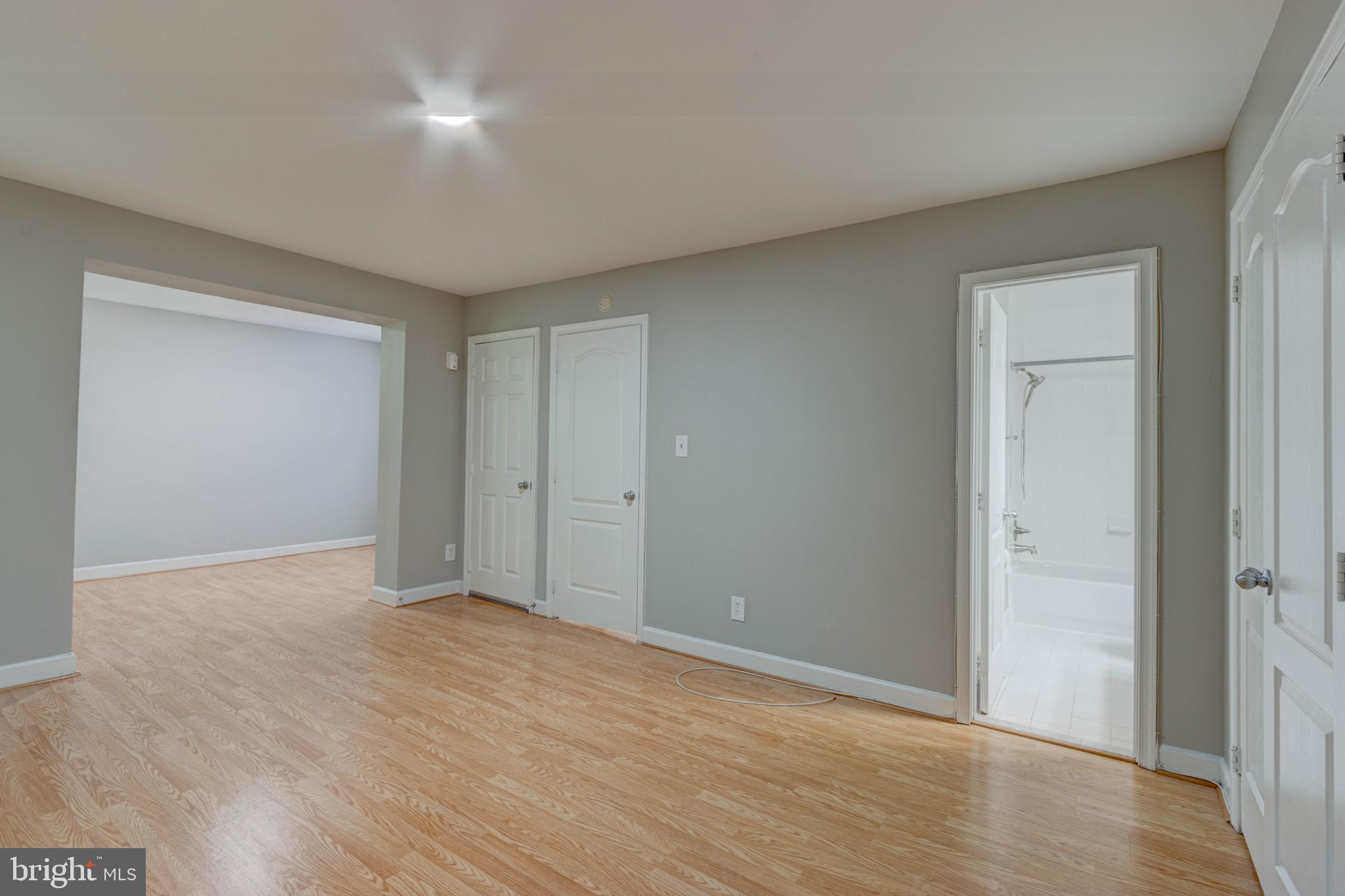 3934 Chesterwood Drive, Unit 3934 Silver Spring, MD 20906 - Photo 21 of 26 a view of an empty room with wooden floor and closet