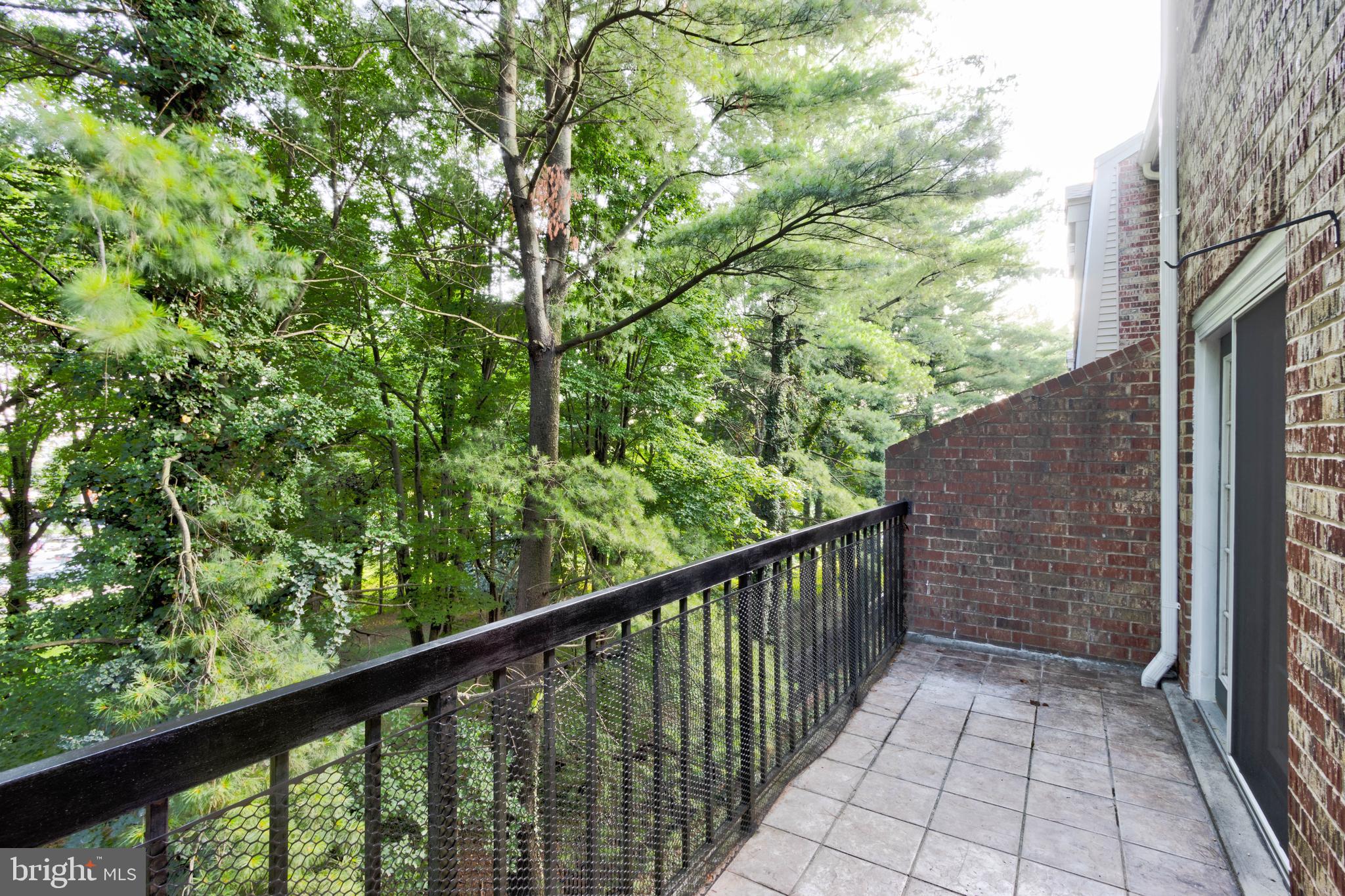 3934 Chesterwood Drive, Unit 3934 Silver Spring, MD 20906 - Photo 25 of 26 a view of a balcony with wooden fence