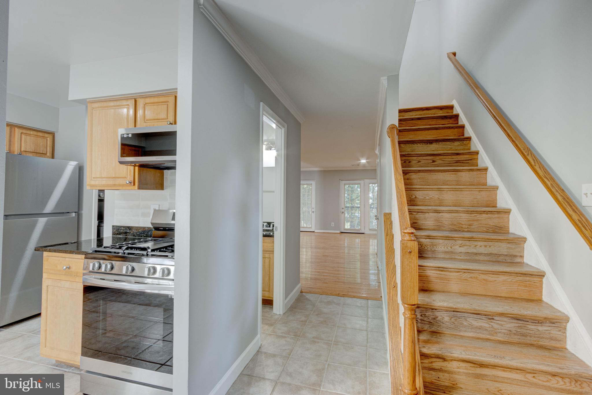 3934 Chesterwood Drive, Unit 3934 Silver Spring, MD 20906 - Photo 4 of 26 a view of kitchen and hallway with wooden floor