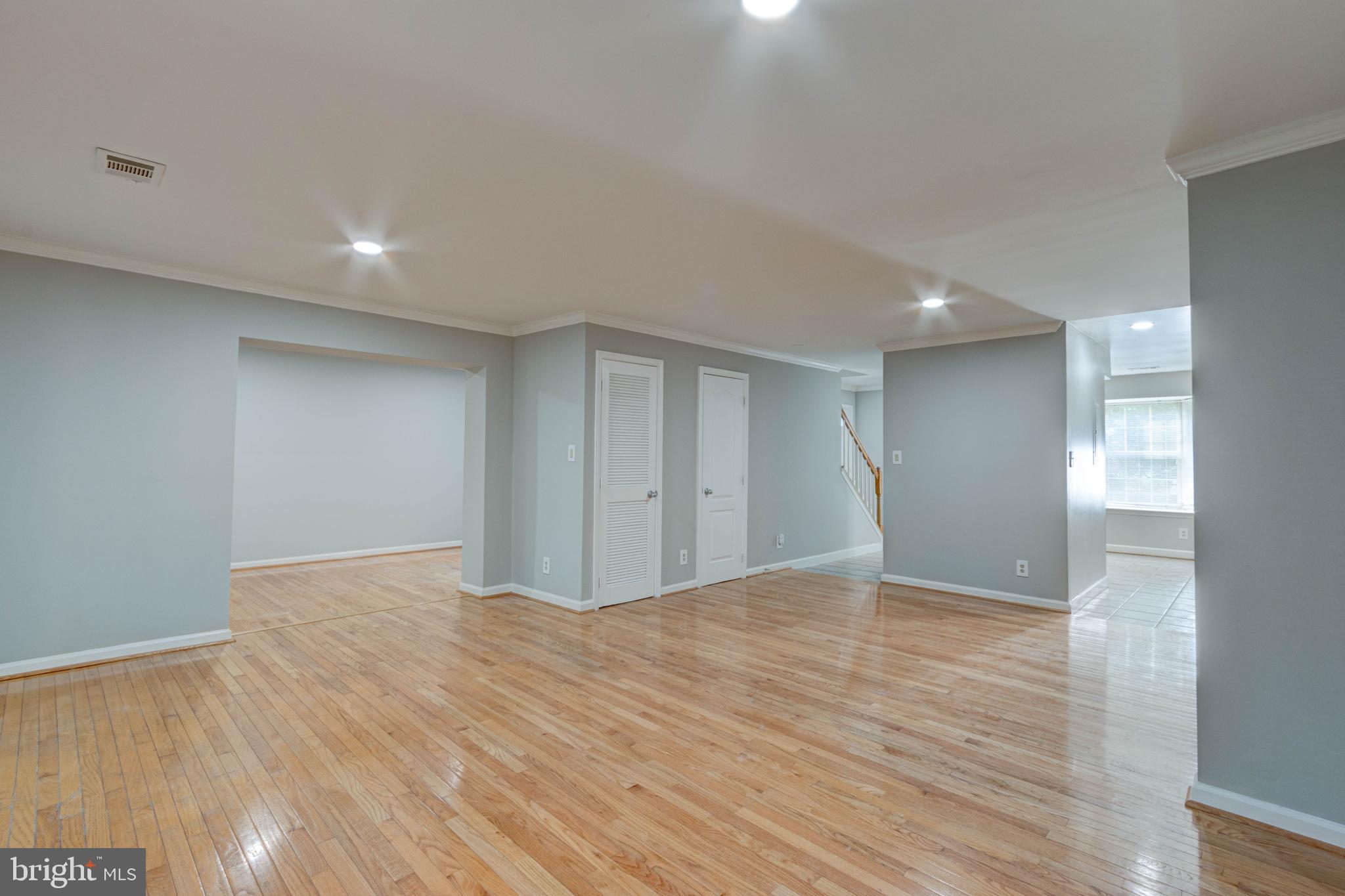 3934 Chesterwood Drive, Unit 3934 Silver Spring, MD 20906 - Photo 9 of 26 a view of an empty room with wooden floor and closet
