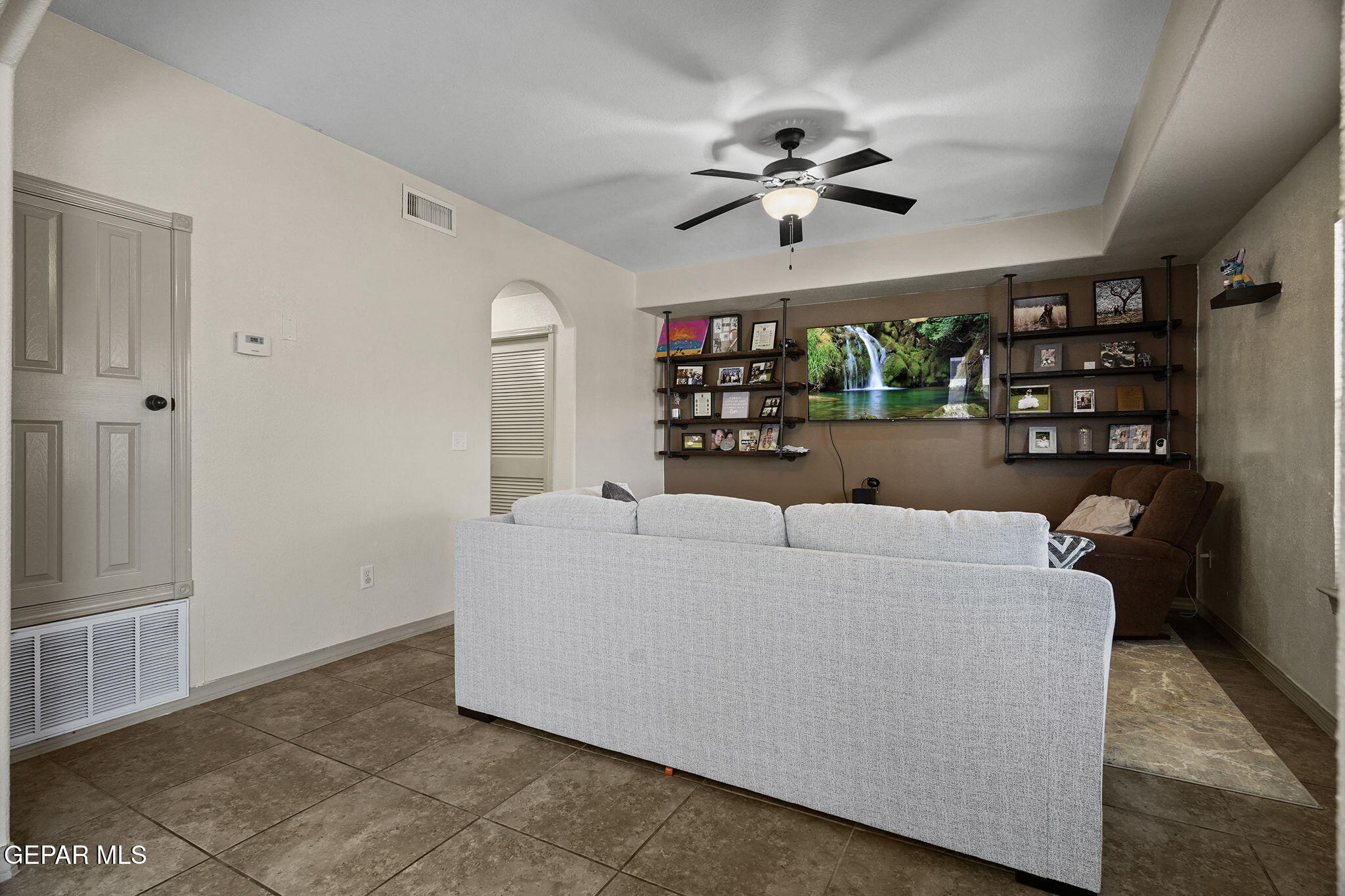 3152 Rustic Hidden Drive El Paso, TX 79938 - Photo 15 of 38 a living room with furniture and a chandelier