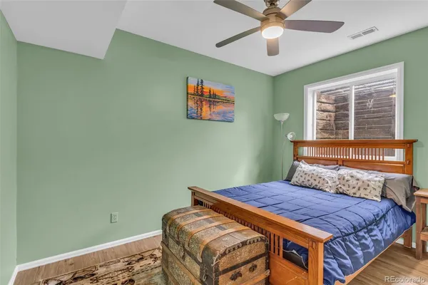 a bedroom with furniture and a window