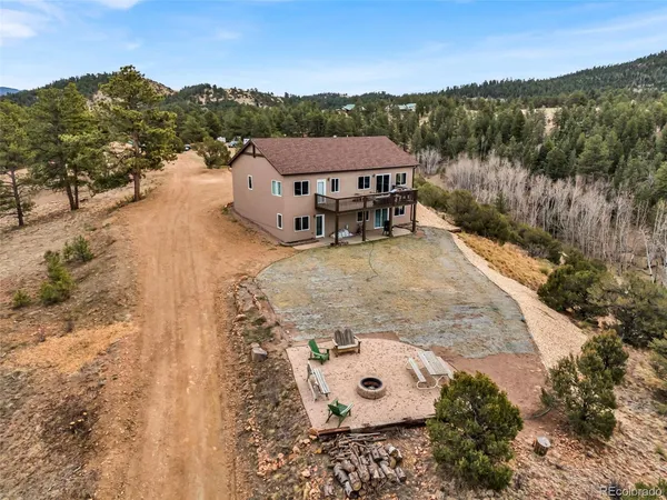 a big house with a big yard and large trees