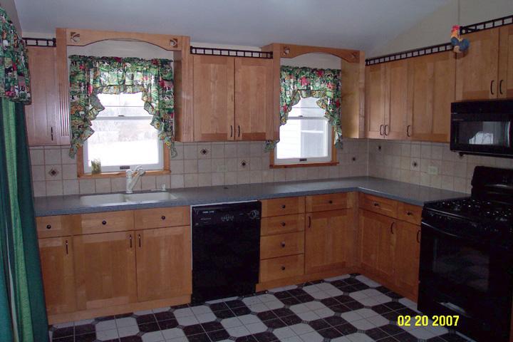 220 Hawk Farm Road Kunkletown, PA 18058 - Photo 10 of 10 a kitchen with stainless steel appliances granite countertop white cabinets and window