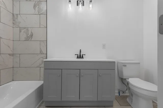 a bathroom with a sink and mirror