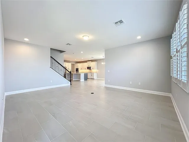 a view of an empty room with a large window