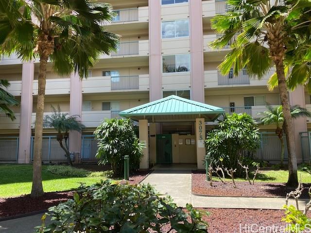 3075 Ala Poha Place, Unit 101 Honolulu, HI 96818 - Photo 1 of 1 a front view of a house with a yard