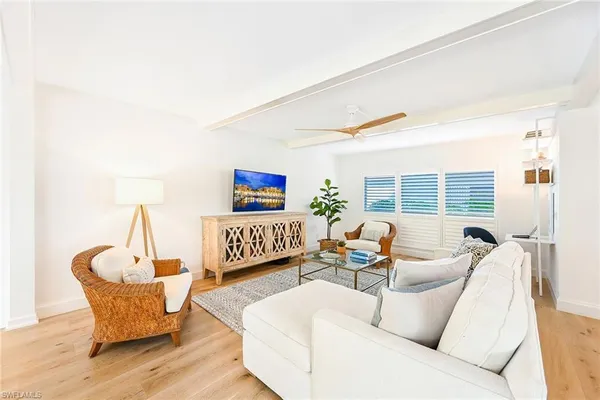 a living room with furniture and a table