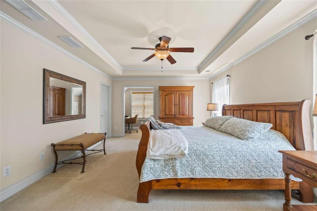 42 Pintail Lane Jefferson, GA 30549 - Photo 23 of 42 a bedroom with a bed and a chandelier