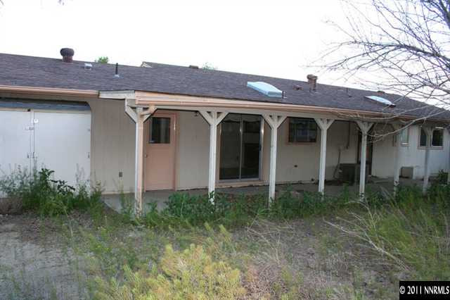 698 Empire Road Dayton, NV 89403 - Photo 8 of 12 a front view of a house with garden