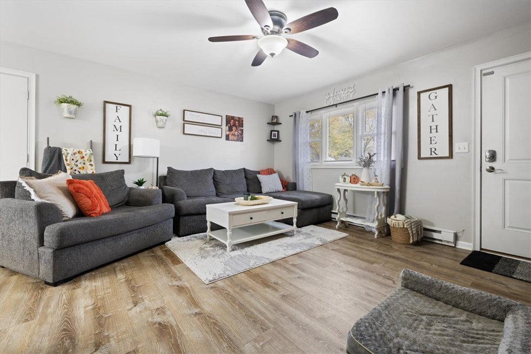 1482 Lee Road Troy, OH 45373 - Photo 6 of 30 Bright and inviting living space with durable hardwood flooring and abundant natural light.