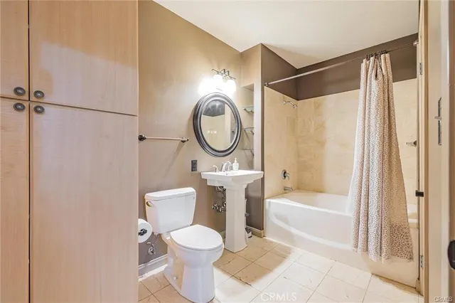 a bathroom with a toilet a sink and a bathtub