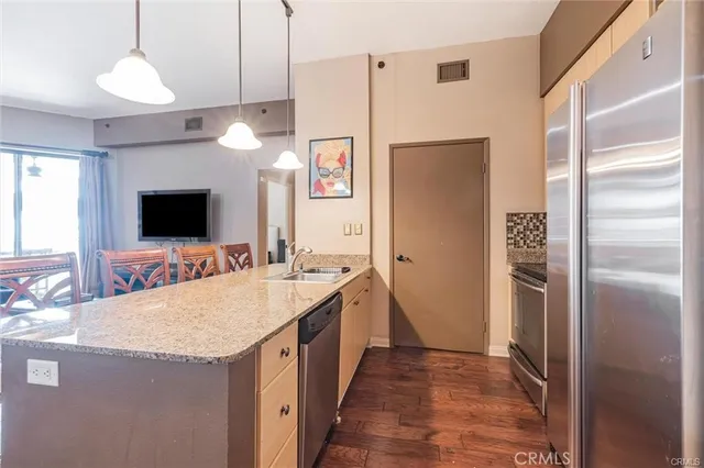 a bathroom with a sink a large mirror and a shower