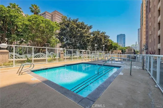 swimming pool view with a outdoor seating
