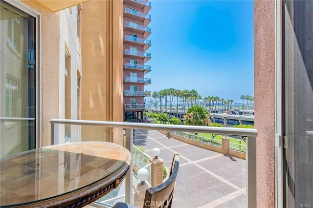 a view of a balcony dining table and chairs