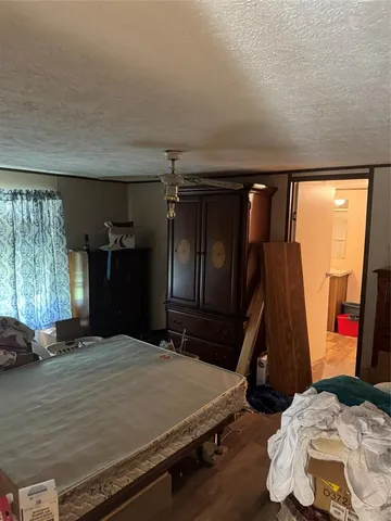 a bedroom with a bed and a closet