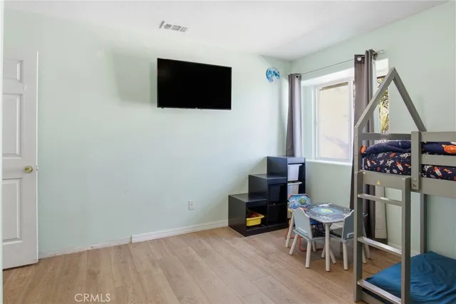 a view of a livingroom with furniture and a flat screen tv