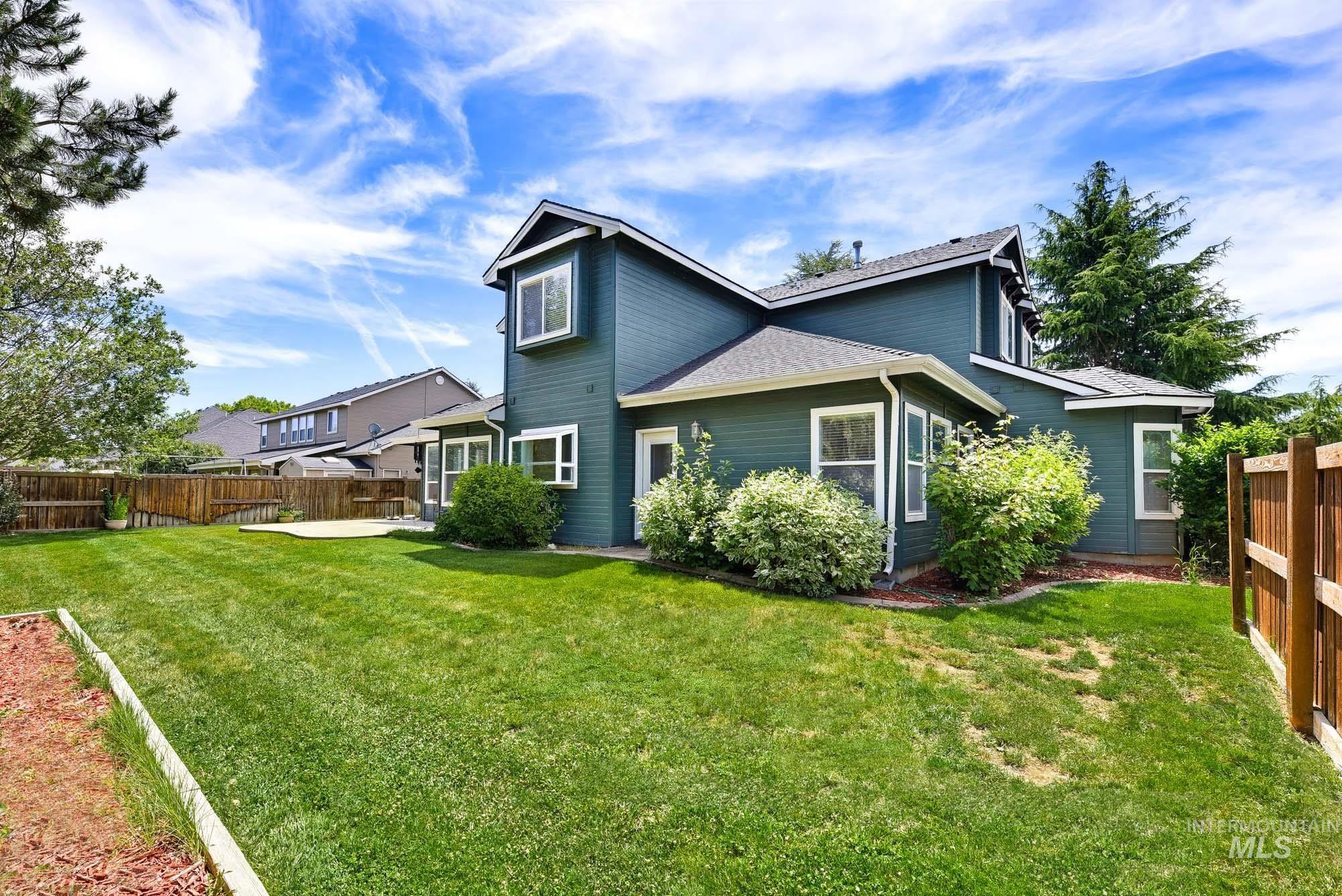 2172 West Cedar Grove Street Meridian, ID 83646 - Photo 40 of 49 Expansive green lawn with a concrete patio