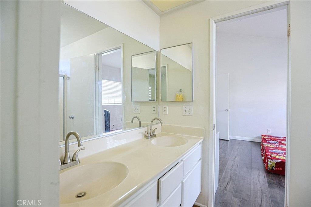 7912 2nd Street, Unit 4 Stanton, CA 90680 - Photo 12 of 16 a bathroom with a sink and a mirror