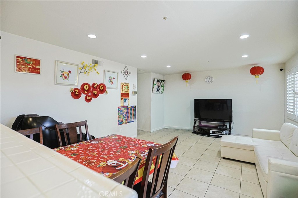 7912 2nd Street, Unit 4 Stanton, CA 90680 - Photo 6 of 16 a bedroom with a bed and a flat screen tv