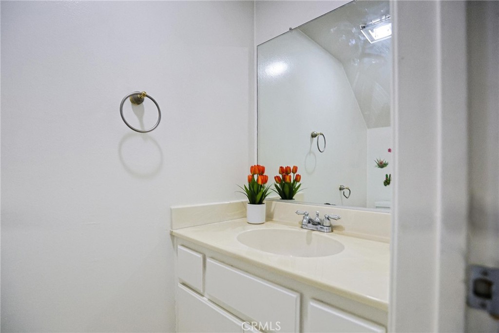 7912 2nd Street, Unit 4 Stanton, CA 90680 - Photo 8 of 16 a bathroom with a sink and a mirror