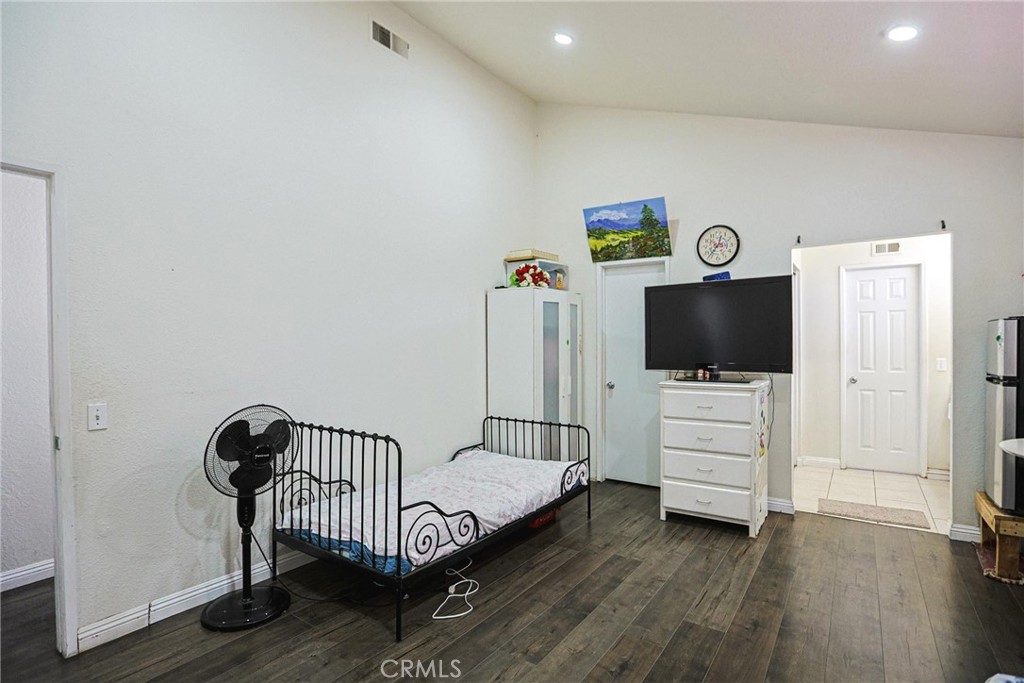 7912 2nd Street, Unit 4 Stanton, CA 90680 - Photo 9 of 16 a living room with furniture and a flat screen tv