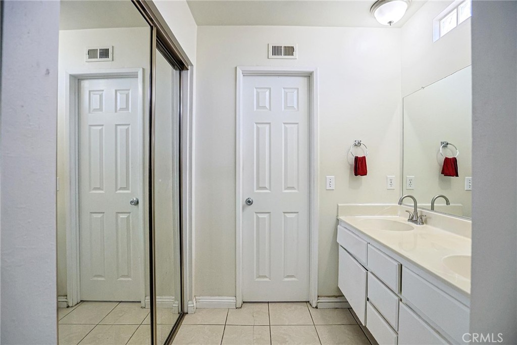 7912 2nd Street, Unit 4 Stanton, CA 90680 - Photo 10 of 16 a bathroom with a sink and a mirror
