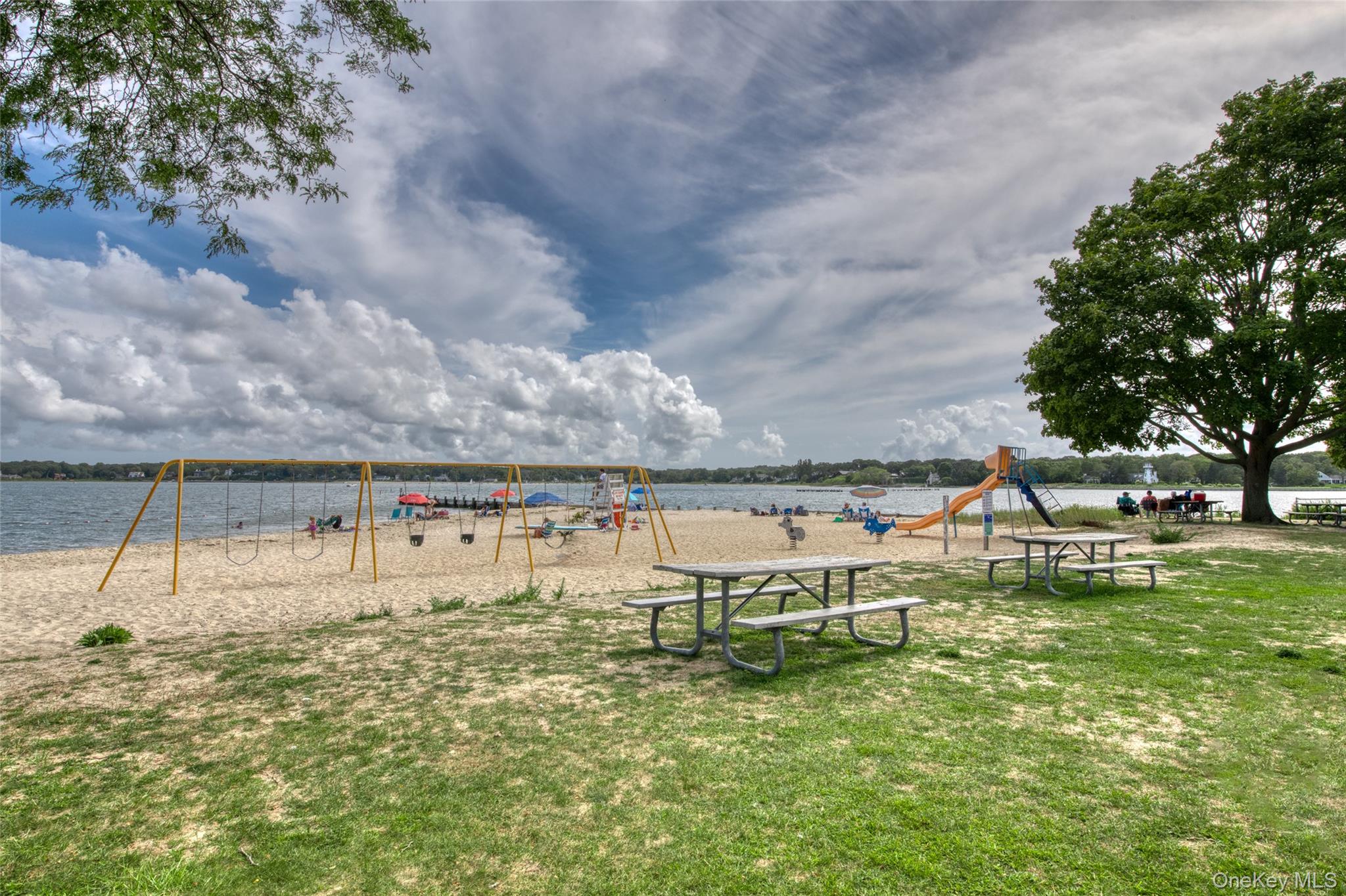 385 Cottage Place Southold, NY 11971 - Photo 13 of 14 a view of a swimming pool with an outdoor seating and a yard