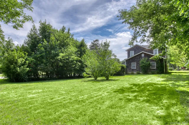 a house with a tree in front of it