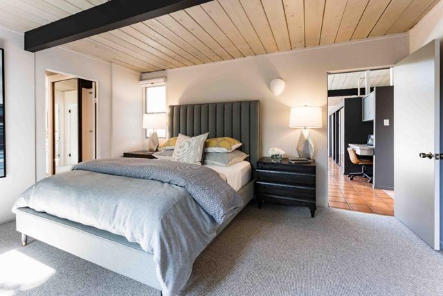 a bedroom with a bed and a walk in closet