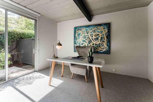 a view of a workspace with furniture